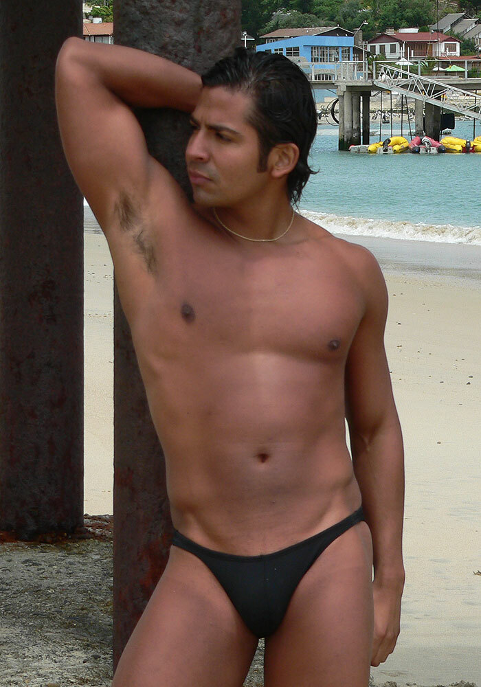 JASZ Swimsuit Bikini black beside pole one arm raised